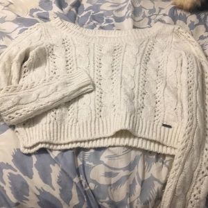 Cropped cable knit sweater